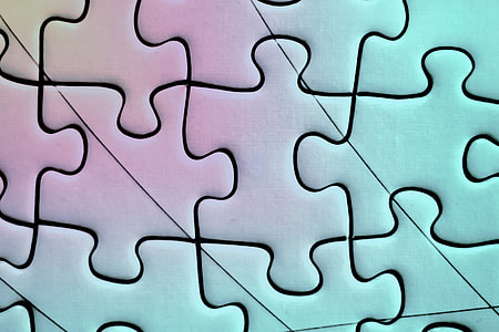 closeup photo of green and purple jigsaw puzzle thumbnail