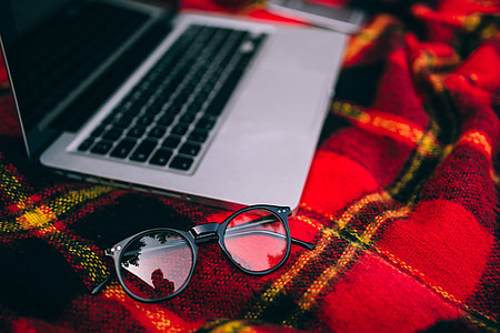 Apple Macbook on a red blanket thumbnail