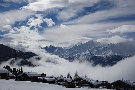 mountains covered with clouds during daytime thumbnail