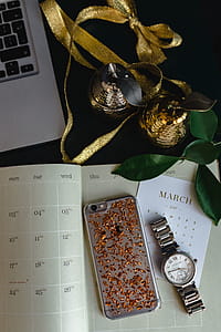 Home office desk with Macbook, iPhone, calendar, watch & organizer thumbnail