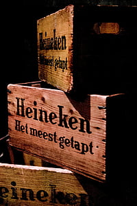 three brown wooden Heineken beer crates thumbnail