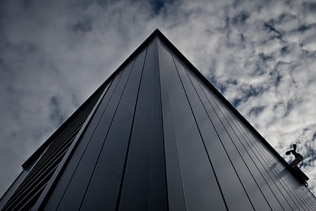 Worm's Eye View of Building Under White Cloudy Sky thumbnail