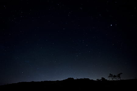 landscape photography of mountain during night time thumbnail
