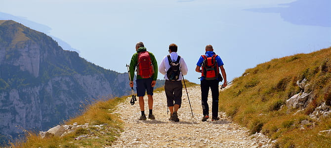 three men hiking on mountain thumbnail
