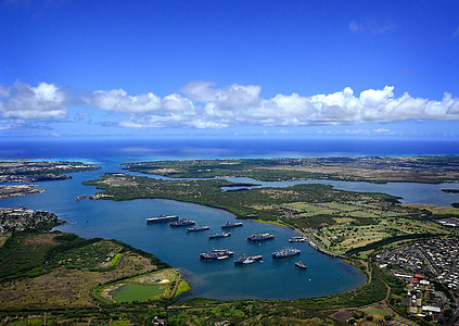 boat on body of water under blue sky thumbnail