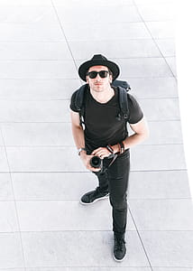 Man Holding Canon Dslr Camera thumbnail