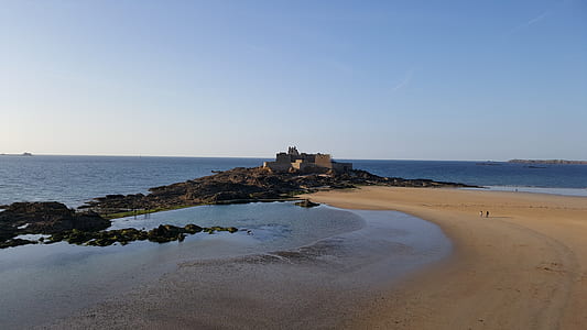 scenery of beach sand beside ocean thumbnail