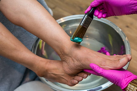 person's feet being brushed by another person thumbnail
