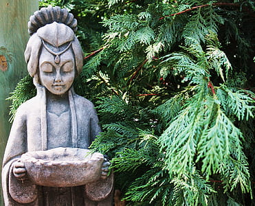 woman wearing dress and holding out basket statue thumbnail