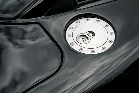 selective focus photo of vehicle gas tank cover thumbnail