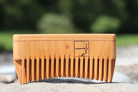 brown wooden tool on white surface thumbnail