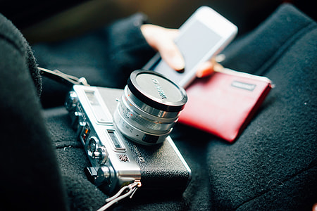 Photographer with camera and phone thumbnail