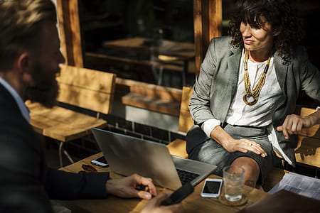 woman sitting on bench in front of man and laptop thumbnail