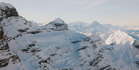 snow covered mountains over horizon thumbnail