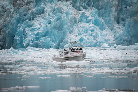 white boat surrounded by ice thumbnail