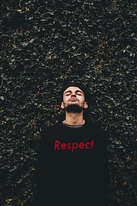 man standing in front of hedge thumbnail