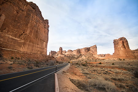 desert and asphalt road during daytime thumbnail