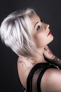 Woman Wearing Black Shirt With Tattoo and Red Lipstick thumbnail