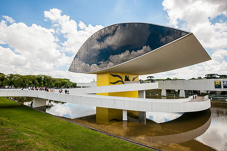 black and white museum under blue sky and white clouds thumbnail