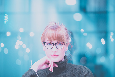 woman in gray turtleneck fabric tops with brown and black eyeglasses thumbnail
