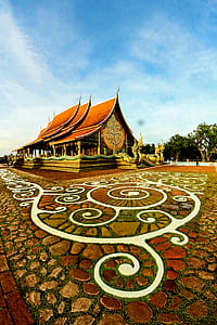 Brown Pagoda Temple Near Green Trees Under Blue Sky at Daytime thumbnail
