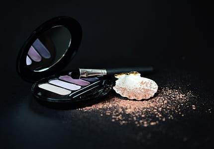 black eyeshadow palette on black surface thumbnail