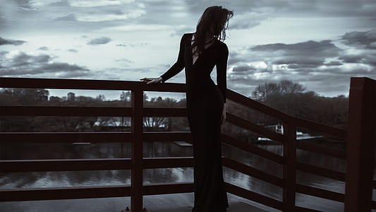 woman in black long-sleeved long dress thumbnail