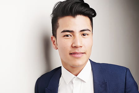 man in blue suit jacket and white dress shirt thumbnail