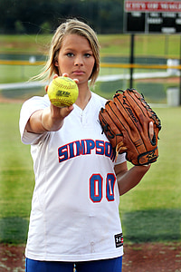 shallow focus photography of woman holding green baseball thumbnail