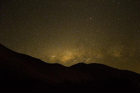 aerial photography of mountain and sky at night time thumbnail