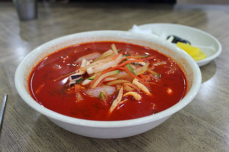bowl of vegetable soup with red sauce thumbnail