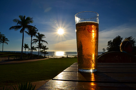glass of beer on wall fronting sun thumbnail