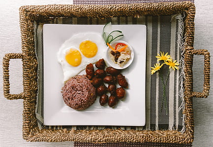 flat-lay photography of fried egg, meats, and rice platter on tray thumbnail