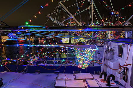 PORT DE GRAVE, NEWFOUNDLAND AND LABRADOR, CANADA - DECEMBER 22, 2017. Fishing vessels at night celebrating the Christmas season with lights, taken on December 22, 2017 in Port De Grave. thumbnail