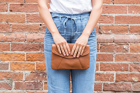 Brown Clutch Gently Held Photo thumbnail