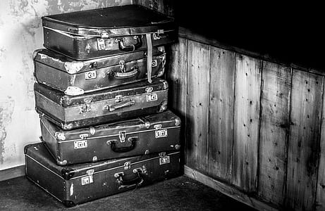 stacked briefcase in grayscale photography thumbnail