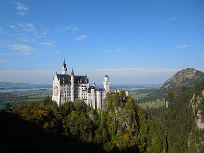 aerial view photography of white castle under clear blue sky during daytime thumbnail