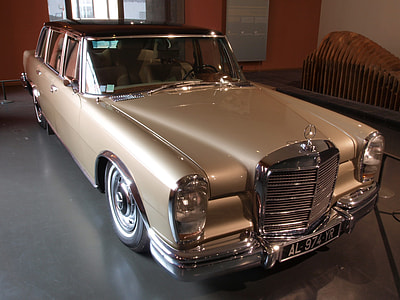 vintage brown Mercedes-Benz sedan in museum thumbnail