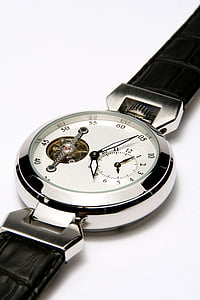 round silver-colored chronograph watch with black leather band on white panel thumbnail