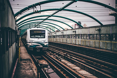 Gray and Green Train on Railings during Daytime thumbnail