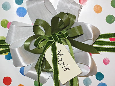 green and white ribbon tied gift thumbnail