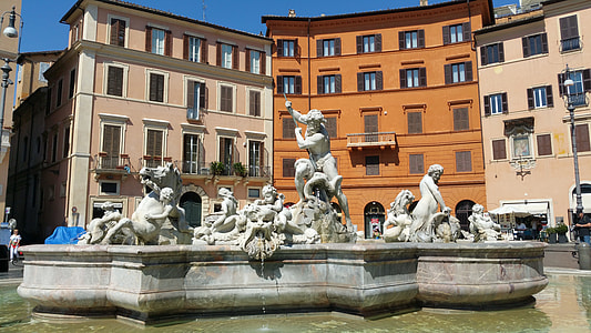 photo of man holding spear between cherub fountain thumbnail