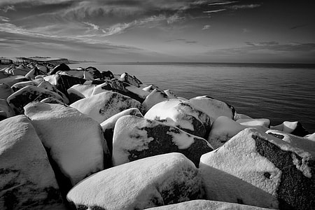 Winter time scene of some snow-covered rocks. Image captured on the coast of Kent, England thumbnail