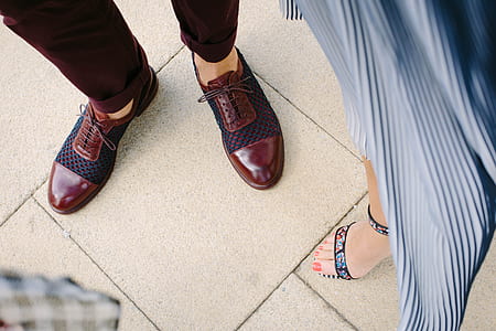 person wearing red leather oxford hsoes thumbnail