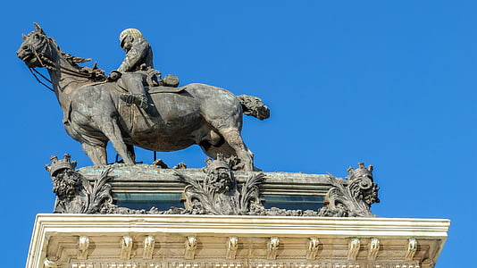 man riding horse statue under blue sky thumbnail