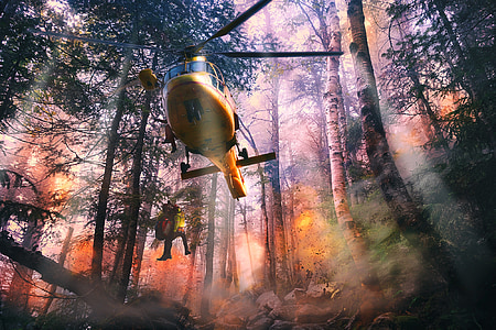 yellow helicopter dropping person at forest digital wallpaper thumbnail