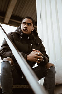 man sitting on staircase thumbnail
