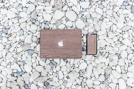 brown MacBook on top of rocks thumbnail