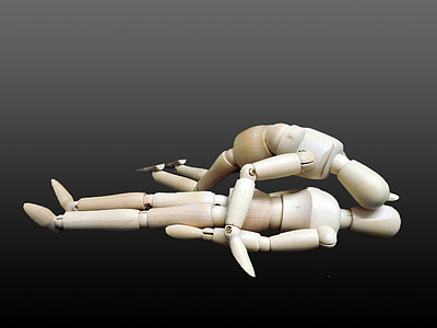 two wooden mannequins on ground thumbnail