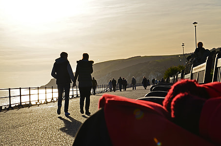 silhouette of people on sidewalk during daytime thumbnail
